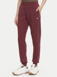 Guess Spodnie dresowe V4YB08 KCAY2 Bordowy Regular Fit. Czerwone spodnie dresowe Guess, z aplikacjami, z dresówki. Za 344.99 zł.