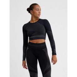 Damska bluzka treningowa bezszwowa z długim rękawem Hummel. Niebieskie bluzki Hummel, bez wzorów, z materiału, sportowe, bez kołnierzyka, bez ramiączek. Za 177.00 zł.