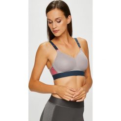 Triumph - Biustonosz. Szare biustonosze sportowe Triumph, bez wzorów, z bawełny. W wyprzedaży za 139.90 zł.