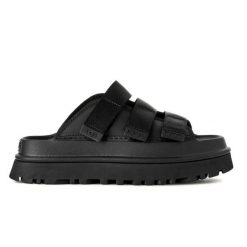 Damskie japonki klapki W GOLDENGLOW SLIDE. Czarne klapki UGG, bez wzorów, z materiału, bez obcasa, bez zapięcia. Za 497.25 zł.
