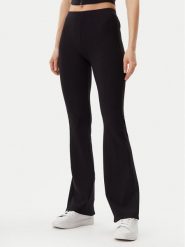 Guess Legginsy V5GB11 KCRS2 Czarny Regular Fit. Czarne legginsy Guess, z aplikacjami, z wiskozy. Za 229.99 zł.