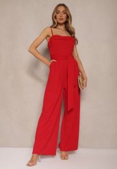 Czerwony Taliowany Kombinezon z Paskiem Desine. Czerwone sukienki Renee, bez wzorów, eleganckie, bez kołnierzyka, bez ramiączek, dopasowane. W wyprzedaży za 83.99 zł.