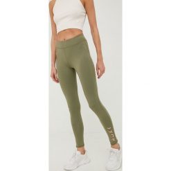 Roxy legginsy treningowe Good Morning Midnight damskie kolor zielony z nadrukiem. Zielone legginsy Roxy, bez wzorów, z materiału. W wyprzedaży za 129.99 zł.