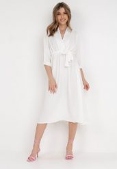 Biała Sukienka Rheniolea. Białe sukienki Born2be, m, bez wzorów, eleganckie, bez kołnierzyka, bez ramiączek, midi, kopertowe. Za 129.99 zł.