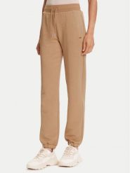 Guess Spodnie dresowe V5YB06 KBSL2 Beżowy Regular Fit. Brązowe spodnie dresowe Guess, z aplikacjami, z dresówki. Za 259.99 zł.