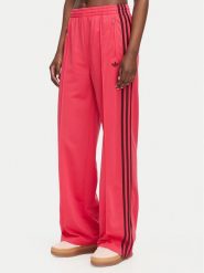Adidas Spodnie dresowe Firebird Loose Tracksuit KW0228 Różowy Loose Fit. Czerwone spodnie dresowe adidas, bez wzorów, z dresówki. Za 299.99 zł.
