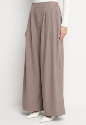 Jasnobrązowe Spodnie o Fasonie Palazzo z Wsuwanymi Kieszeniami Adivena. Brązowe jeansy Born2be, bez wzorów, z jeansu, eleganckie, z podwyższonym stanem, długie. Za 99.99 zł.