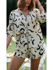 Milan Kiss Bluzka w kolorze kremowo-czarnym rozmiar: S. Brązowe bluzki Milan Kiss, s, bez wzorów, z wiskozy, bez kołnierzyka, bez ramiączek. Za 173.99 zł.