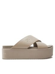 Calvin Klein Jeans Klapki Flatform Cross Mg Uc YW0YW01349 Beżowy. Brązowe klapki Calvin Klein Jeans, bez wzorów, z jeansu, bez obcasa, bez zapięcia. Za 259.99 zł.