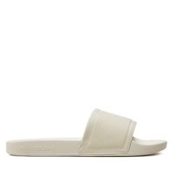 Klapki Calvin Klein Jeans. Białe klapki Calvin Klein Jeans, bez wzorów, z jeansu, bez obcasa, bez zapięcia. Za 219.99 zł.