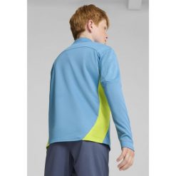 Młodzieżowa bluza treningowa Manchester City F.C. z zamkiem 1/4 PUMA. Niebieskia bluzy Puma, m, bez wzorów, bez kaptura, do piłki nożnej. W wyprzedaży za 212.00 zł.
