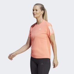 Koszulka do biegania damska Adidas Own the Run Tee. Brązowe t-shirty sportowe adidas, xs, bez wzorów, z dzianiny, bez ramiączek, do biegania. Za 140.35 zł.