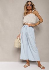 Jasnoniebieskie Spodnie High Waist z Szerokimi Nogawkami z Wiskozą Wykończone Gumką w Talii Crisantas. Niebieskie jeansy Renee, m, bez wzorów, z jeansu, biznesowe, z podwyższonym stanem. W wyprzedaży za 23.99 zł.