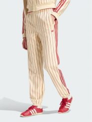 Adidas Spodnie dresowe Pinstripe Firebird Track Ptan KT1851 Kremowy Regular Fit. Białe spodnie dresowe adidas, bez wzorów, z dresówki. Za 399.99 zł.