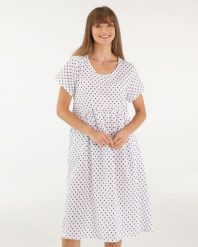 BIAŁA SUKIENKA W GRANATOWE GROCHY. Białe sukienki Unisono, l, bez wzorów, z bawełny, bez kołnierzyka, bez ramiączek, mini. Za 179.00 zł.