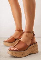 Brązowe Sandały VICES na Koturnie z Imitacji Korka z Paskiem wokół Kostki Kelania. Brązowe sandały Born2be, bez wzorów, eleganckie, bez obcasa, na koturnie, bez zapięcia. Za 119.99 zł.