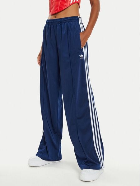 Adidas Spodnie dresowe Firebird IL3817 Granatowy Loose Fit. Niebieskie spodnie dresowe adidas, bez wzorów, z dresówki. Za 239.99 zł.
