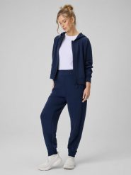 4F Spodnie dresowe z modalem joggery damskie - granatowe XS. Niebieskie spodnie materiałowe 4f, bez wzorów, z dresówki. Za 189.99 zł.