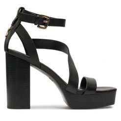 Sandały DKNY. Czarne sandały DKNY, bez wzorów, bez obcasa, na słupku, bez zapięcia. Za 629.99 zł.