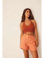 NA-KD Szortyu w kolorze brzoskwiniowym rozmiar: 34. Pomarańczowe szorty NA-KD, bez wzorów. Za 32.98 zł.