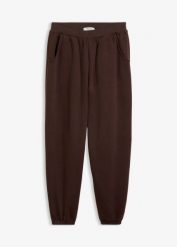 Spodnie dresowe o balonowym kroju. Niebieskie spodnie dresowe bonprix, bez wzorów, z dresówki. Za 54.99 zł.