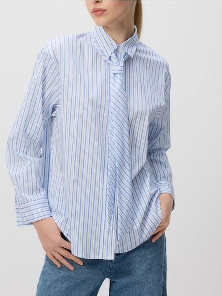 Koszula z ozdobnym wiązaniem - jasnoniebieski. Niebieskie koszule Reserved, l, bez wzorów, z bawełny, bez kołnierzyka, bez ramiączek. W wyprzedaży za 59.99 zł.