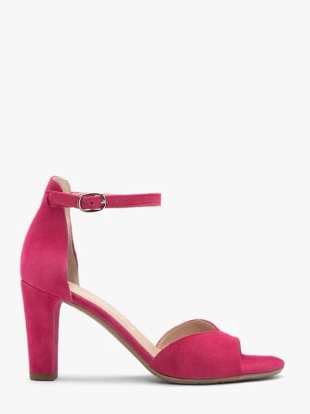 Fuksjowe sandały damskie na słupku. Czerwone sandały Ryłko, bez wzorów, ze skóry, eleganckie, bez obcasa, na słupku, bez zapięcia. W wyprzedaży za 249.99 zł.