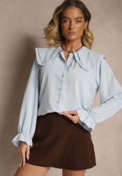 Jasnoniebieska Koszula Ozdobiona Falbankami i Kołnierzykiem Evirana. Niebieskie koszule Renee, uniwersalny, z aplikacjami, z jeansu, eleganckie, bez kołnierzyka, bez ramiączek. W wyprzedaży za 63.99 zł.