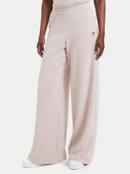 Guess Spodnie dresowe V4YB07 KCAY2 Różowy jasny Relaxed Fit. Czerwone spodnie dresowe Guess, z aplikacjami, z dresówki. Za 394.99 zł.