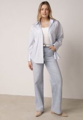 Niebieskie Bawełniane Jeansy o Szerokim Kroju z Wysokim Stanem Jendrea. Niebieskie jeansy Born2be, bez wzorów, z bawełny, z podwyższonym stanem. Za 129.99 zł.