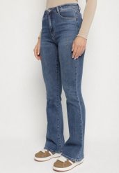 Niebieskie Elastyczne Jeansy o Kroju Dzwonów Zenaia. Niebieskie jeansy Born2be, bez wzorów, z jeansu, eleganckie, z podwyższonym stanem. Za 119.99 zł.