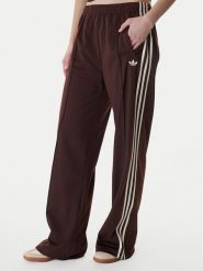 Adidas Spodnie dresowe Firebird KG3706 Brązowy Loose Fit. Brązowe spodnie dresowe adidas, bez wzorów, z dresówki. Za 299.99 zł.