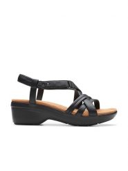 Clarks Skórzane sandały "Tuleah May" w kolorze czarnym na obcasie rozmiar: 39,5. Czarne sandały Clarks, bez wzorów, z otwartym noskiem, bez obcasa, na koturnie, bez zapięcia. Za 225.70 zł.
