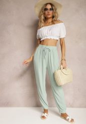 Miętowe Casualowe Spodnie High Waist Wykończone Gumką w Pasie Dimrue. Zielone jeansy Renee, l, bez wzorów, z jeansu, eleganckie, z podwyższonym stanem. W wyprzedaży za 29.99 zł.