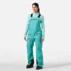 Kombinezony damskie Helly Hansen Powderqueen. Zielone kombinezony Helly Hansen, na zimę, m, bez wzorów, sportowe, bez kołnierzyka, bez ramiączek. Za 1,305.50 zł.