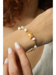 Pierres delicates Pozłacana bransoletka z kryształami rozmiar: onesize. Pomarańczowe bransoletki Pierres delicates, z kryształem, pozłacane. Za 65.99 zł.