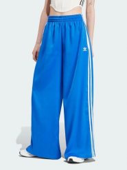 Adidas Spodnie dresowe w kolorze niebieskim rozmiar: 44. Niebieskie spodnie dresowe adidas, bez wzorów, z dresówki. Za 140.86 zł.