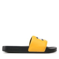 Klapki Tommy Jeans. Żółte klapki Tommy Jeans, bez wzorów, z jeansu, bez obcasa, bez zapięcia. Za 229.99 zł.