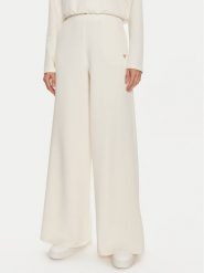 Guess Spodnie dresowe Olympe V4YB07 KCAY2 Beżowy Relaxed Fit. Brązowe spodnie dresowe Guess, z aplikacjami, z dresówki. Za 269.99 zł.
