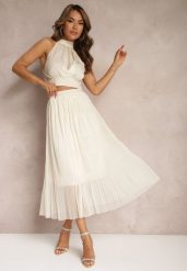 Jasnobeżowa Rozkloszowana Spódnica z Tiulu Wykończona Gumką w Pasie Risshara. Brązowe spódnice Renee, na co dzień, l, bez wzorów, z tiulu, eleganckie, midi, dopasowane. W wyprzedaży za 35.99 zł.