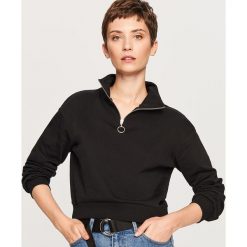 Krótka bluza ze stójką - Czarny. Bluzy marki DOMYOS. W wyprzedaży za 34.99 zł.