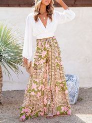 Milan Kiss Spodnie w kolorze jasnozielono-jasnoróżowym rozmiar: L. Różowe spodnie materiałowe Milan Kiss, bez wzorów, z materiału, z podwyższonym stanem. Za 131.12 zł.