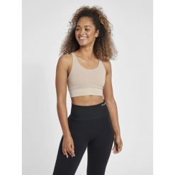Damski bezszwowy biustonosz sportowy Hummel MT Flow. Fioletowe biustonosze sportowe Hummel, bez wzorów, z dzianiny, na fitness i siłownię. Za 229.00 zł.