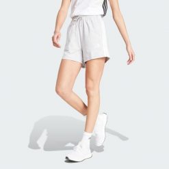 Szorty Essentials 3-Stripes Cotton. Białe szorty sportowe adidas, bez wzorów, z bawełny, z standardowym stanem, na fitness i siłownię. Za 129.00 zł.