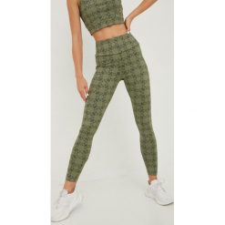 Guess legginsy damskie kolor zielony wzorzyste. Zielone legginsy Guess, z aplikacjami, ze skóry. Za 329.99 zł.