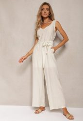 Jasnobeżowy Kombinezon z Wiskozy z Szerokimi Nogawkami z Gumką w Pasie i Materiałowym Paskiem Acladia. Brązowe kombinezony Renee, l, bez wzorów, z materiału, eleganckie, bez kołnierzyka, bez ramiączek. Za 109.99 zł.