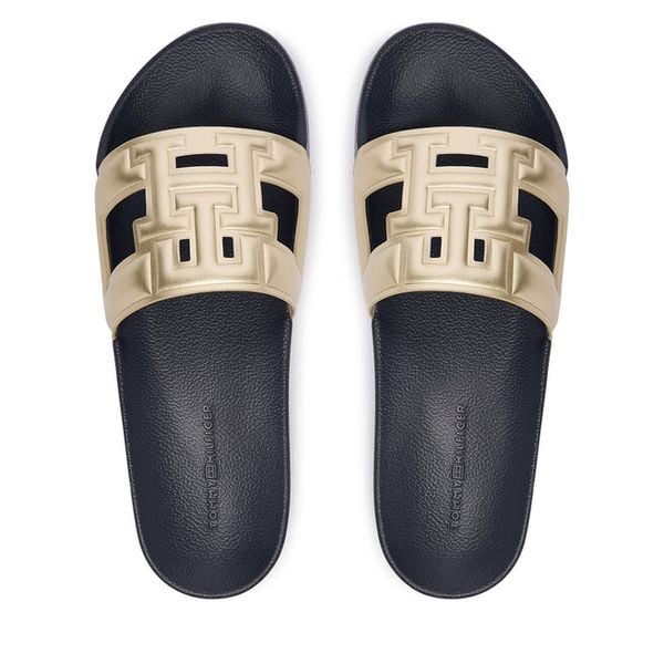Klapki Tommy Hilfiger. Żółte klapki Tommy Hilfiger, bez wzorów, bez obcasa, bez zapięcia. Za 189.99 zł.