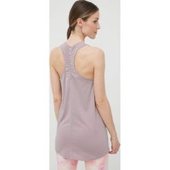Puma top treningowy Studio Foundation 521605 kolor fioletowy. Fioletowe topy Puma, l, bez wzorów, ze skóry, bez kołnierzyka, bez ramiączek. W wyprzedaży za 99.99 zł.