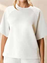 Bluza z krótkim rękawem soft touch - kremowy. Białe bluzy Sinsay, l, bez wzorów, z dzianiny, bez kaptura. Za 39.99 zł.