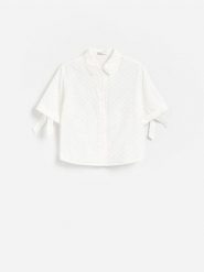 Ażurowa koszula z wiązaniem - złamana biel. Koszule Reserved, l, w ażurowe wzory, z bawełny, bez kołnierzyka, bez ramiączek. Za 119.99 zł.